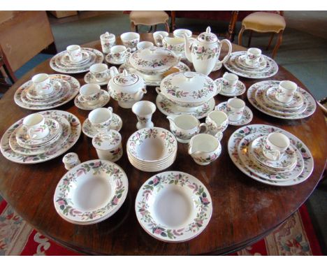 A WEDGWOOD 'HATHAWAY ROSE' BONE CHINA TEA & DINNER SERVICE comprising five tea cups and seven saucers, eight coffee cans and 