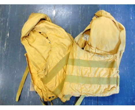 TWO R.A.F. 'MAE WEST' LIFE PRESERVERS the first labelled 'A.M. [below crown] / Contract No. Stores / 5612/C/34C / Type Flap /