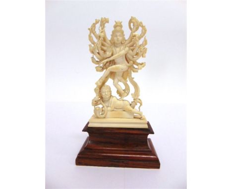 AN INDIAN CARVED IVORY FIGURE OF SHIVA late 19th or early 20th century, in Nataraja (cosmic dancer) position, with eighteen a