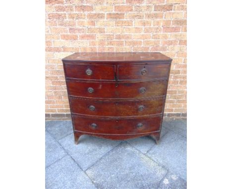 A MAHOGANY BOW FRONT CHEST  of two short and three long drawers on splayed bracket feet, 107cm wide 54cm deep 106cm high