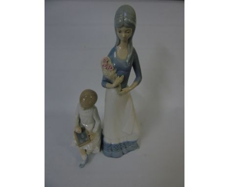 Nao figure of a girl with chalk board and a Spanish figure of a lady