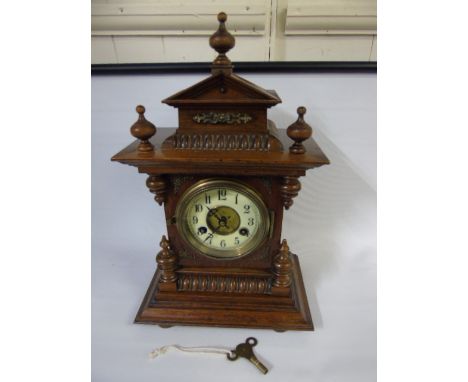 Antique walnut cased bracket clock with enamel dial and key approx. 16" high