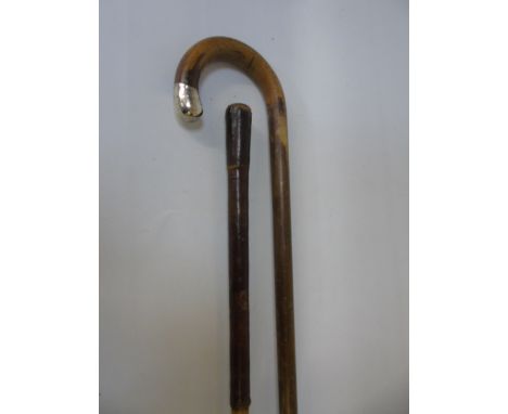 Silver mounted walking stick and a leather handled walking cane