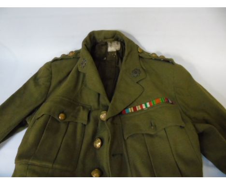 Vintage British army officers uniform with 3 pips and ribbon bar