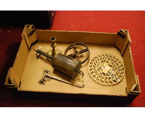Metalwares to include a pierced brass trivet,an C18th brass candlestick and a roasting Jack