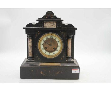 A Victorian black slate mantel clock of architectural form, the enamel chapter ring showing Arabic numerals, eight day moveme