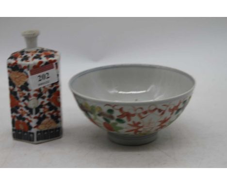 A Chinese porcelain bowl, enamel decorated with flowers, dia.14cm; together with an hexagonal porcelain bottle 