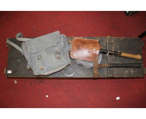 A WWI period pine box containing a WWII Air Ministry escape axe, a WWII trench shovel, with leather case stamped E Stabelmann