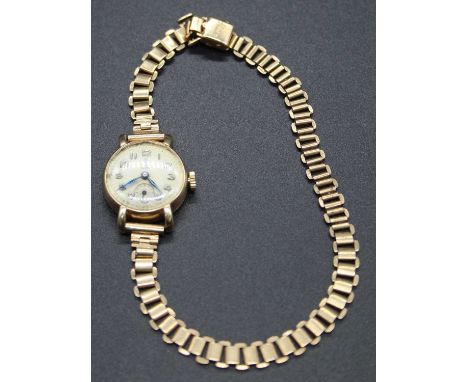 A lady's Tudor Royal 9ct gold cased manual wind wristwatch, case dia.20mm, on 9ct gold bracelet, gross weight 16.6gWinds, tic