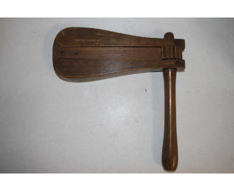 A vintage oak and elm handled football rattle, 35cm