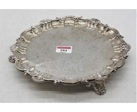 A Victorian silver card waiter, having C-scroll and fan border, maker Henry Wilkinson &amp; Co, London, 12.6ozt, dia.23.5cm