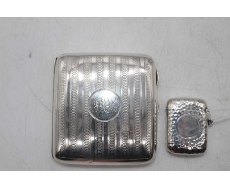 An Edwardian silver vesta of hinged rectangular form having a spot hammered finish, maker Joseph Gloster, Birmingham 1907, to