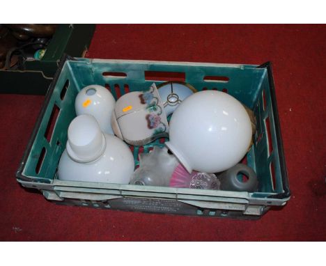 A collection of vintage glass lampshades