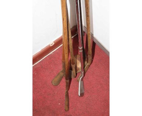 A collection of vintage golf clubs, the longest 115cm