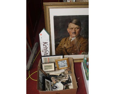 A collection of militaria, mainly German, to include photographs, banknotes, a Kehlstein wooden sign, and a portrait lithogra