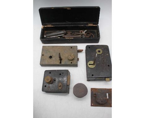 A collection of vintage lock plates and keys 