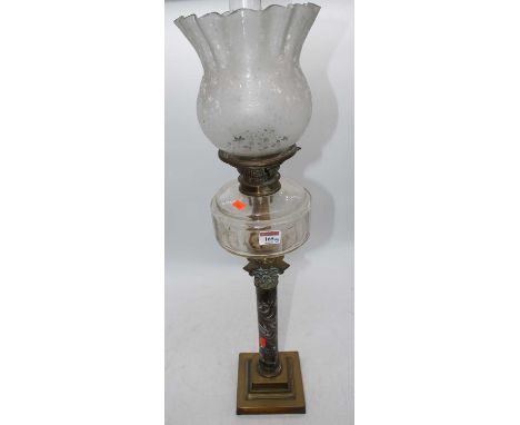 A Victorian brass oil lamp, the acid etched shade above a faceted font and corinthian column stem, height 81cmDrilled hole in