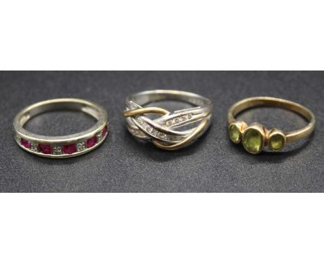 A 9ct white gold, ruby and diamond point half hoop ring, size M; together with a modern 9ct white gold and diamond set crosso