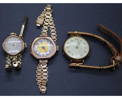A lady's vintage 9ct gold cased wristwatch, on gilt metal bracelet; together with two other 9ct gold cased vintage wristwatch
