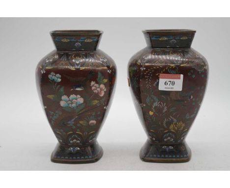 A pair of Chinese cloisonne enamel decorated vases, h.18.5cmBoth with losses to the enamel and pitting.