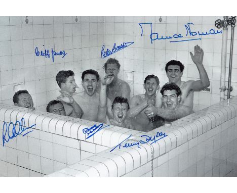 Autographed TOTTENHAM 12 x 8 photo : B/W, depicting Tottenham players celebrating in the bath at White Hart Lane following a 