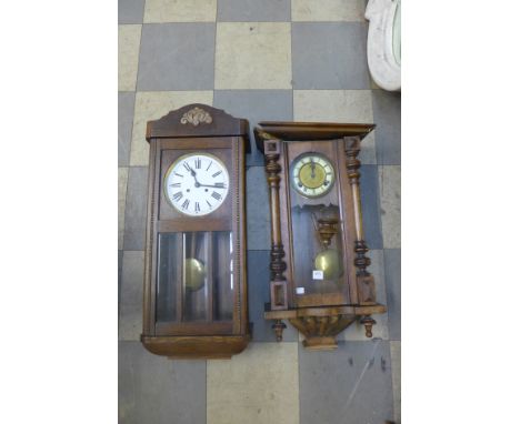 An oak wall clock and a beech Vienna wall clock