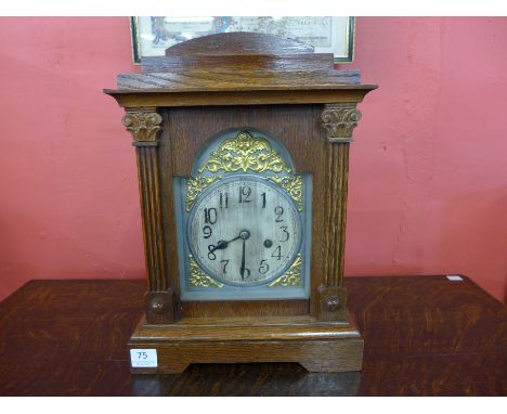 An early 20th Century German oak mantel clock