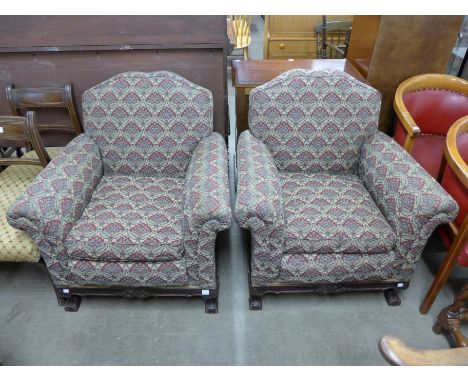 A pair of early 20th Century Chippendale Revival mahogany and upholstered armchairs