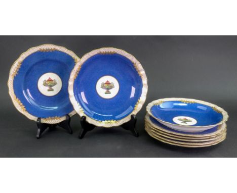 A Spode Copelands china eight piece dessert service, each piece centred by putti resting on a classical urn within a roundel 