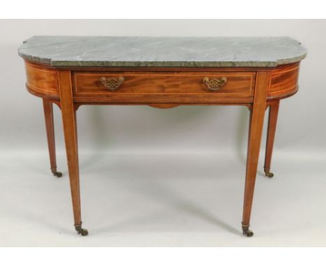 Gillows Lancaster: an Edwardian mahogany boxwood and ebony strung and banded console table, of break bowfront outline, the gr