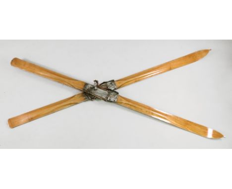 A pair of vintage skis, circa 1900, each numbered '190 630', the mounts detailed 'Special Pilat' 188cm long.
