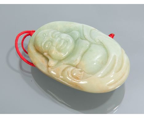 CHINESE JADE CARVING in green tones, showing a monkey, bat and peaches, 6cm long 