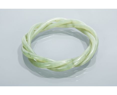 CHINESE SPINACH JADE BANGLE of three intertwined sections 