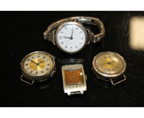 A VINTAGE SILVER CASED WRISTWATCH WITH SILVER STRAP TOGETHER WITH THREE OTHERS (4)