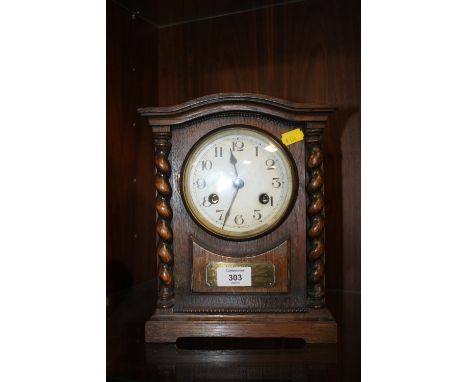 A VINTAGE OAK BARLEYTWIST MANTLE CLOCK