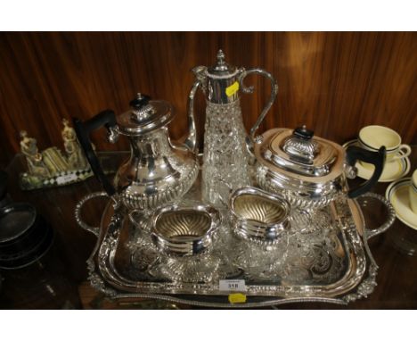 A SILVER PLATED VINERS FOUR PIECE TEA SERVICE TOGETHER WITH A SILVER PLATED SERVING TRAY AND A CLARET JUG