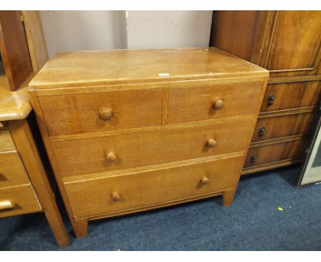 A LIGHT OAK UTILITY STYLE FOUR DRAWER CHEST