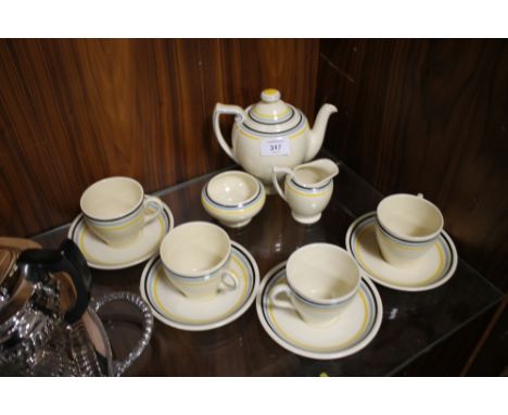AN ART DECO ROYAL DOULTON FOUR PERSON TEA SET MADE FOR DR SCHOLLS FOOT COMFORT SERVICE