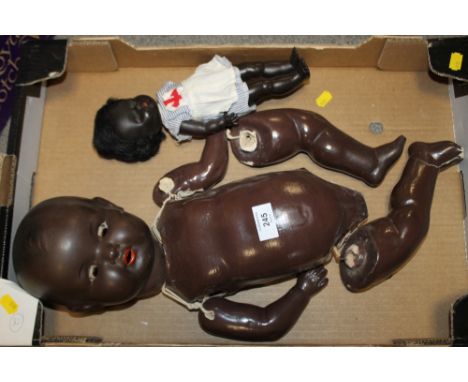 A VINTAGE BLACK A M GERMANY ROLLER EYE DOLL TOGETHER WITH ANOTHER
