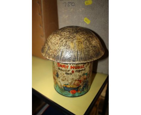 A VINTAGE MABEL LUCIE ATTWELL FAIRY HOUSE BISCUIT AND MONEY BOX