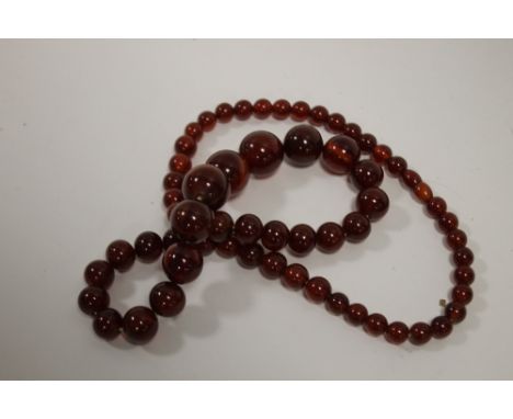 A VINTAGE CHERRY AMBER STYLE NECKLACE