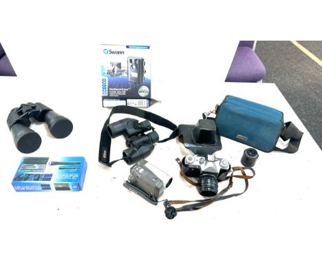 Selection of camera equipment and accessories to include Panasonic cam corder, Swann wild life camera, Zennox binoculars etc