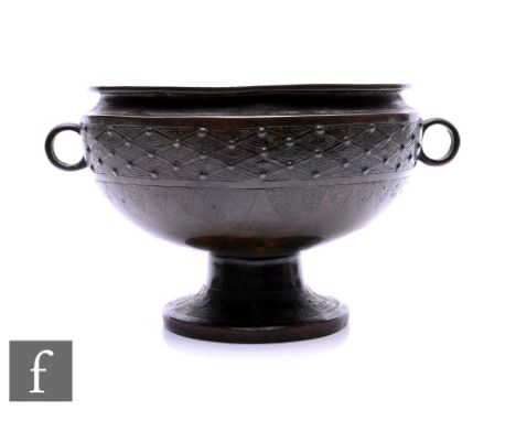 A Chinese Archaic style bronze foot bowl,&nbsp;Dou,&nbsp;the incised footrim with studded exterior design, incised with cross