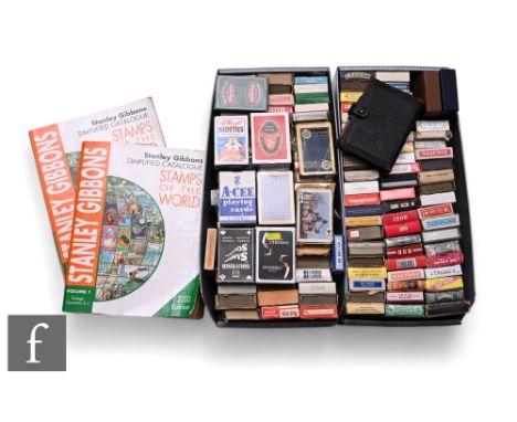 An extensive collection of playing and card games, various subjects, some 1970s or earlier, and two stamp catalogues. (qty) C