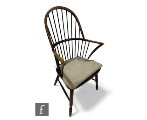 A late 19th Century ask and elm seat Windsor comb back elbow chair on turned legs united by rail stretchers, height 97cm, dep