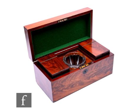 A large 19th Century rectangular mahogany tea caddy, twin lift separate cannisters and later mixing bowl, width 40cm. Conditi
