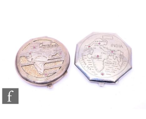A 1950s or earlier silver compact, the cover cut away with a map of central India, and a similar engraved octagonal powder co