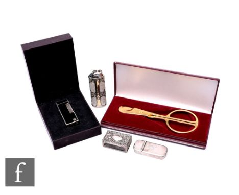 An engine turned silver vesta case with double hinged top by Hudson &amp; Co London, an embossed silver match slip, a Dunhill