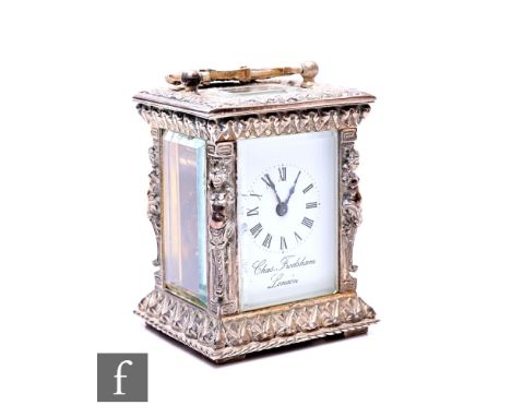 A miniature carriage clock by Charles Frodsham London, white enamelled dial, with key, height 9cm. Condition reports for each