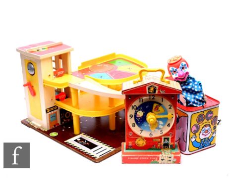 A vintage Fisher Price garage, a Fisher Price clock, circa 1960s, and Mattel tinplate Jack in the box. (3) Condition reports 
